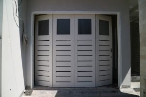 rel pintu garasi surabaya
